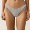 Bikinis-Slip mit mittlerer Bedeckung im U-Cut-Schnitt aus Jacquard mit Polka-Dot-Muster Bikinis-Slip mit mittlerer Bedeckung im U-Cut-Schnitt aus Jacquard mit Polka-Dot-Muster
