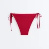 Bikinis-Slip mit mittlerer Bedeckung und Bindebändern Bikinis-Slip mit mittlerer Bedeckung und Bindebändern