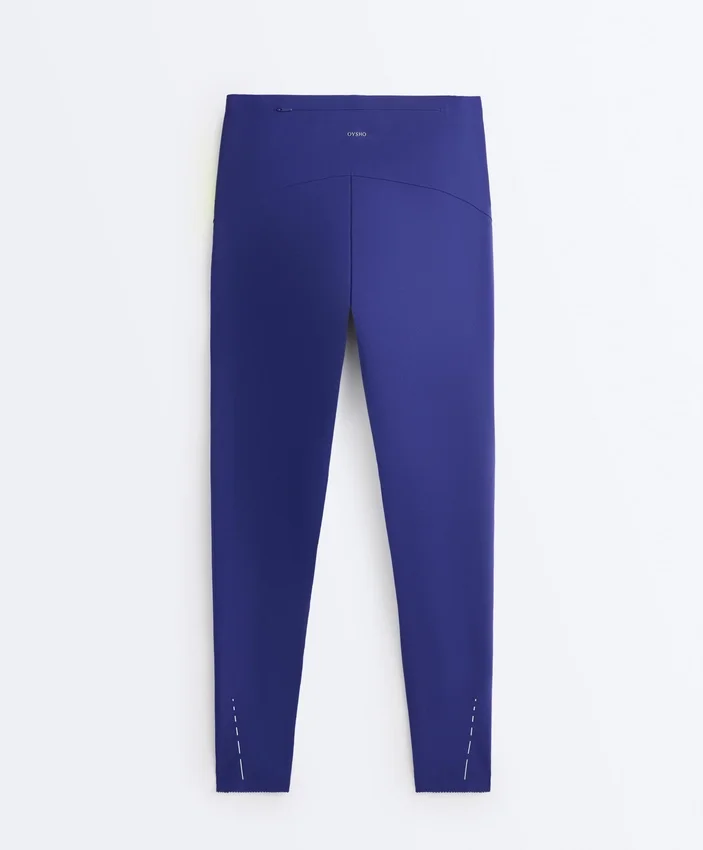 Compressive Leggings mit hoher Taille, reflektierenden Details und knöchellanger Passform Compressive Leggings mit hoher Taille, reflektierenden Details und knöchellanger Passform
