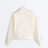 Jacke aus Piqué-Baumwolle mit Fischgrätenmuster an den Seiten Jacke aus Piqué-Baumwolle mit Fischgrätenmuster an den Seiten