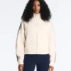 Jacke aus Piqué-Baumwolle mit Fischgrätenmuster an den Seiten Jacke aus Piqué-Baumwolle mit Fischgrätenmuster an den Seiten