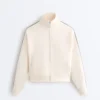 Jacke aus Piqué-Baumwolle mit Fischgrätenmuster an den Seiten Jacke aus Piqué-Baumwolle mit Fischgrätenmuster an den Seiten