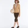 Jacke im Neopren-Look mit Schößchen und Rippbündchen Jacke im Neopren-Look mit Schößchen und Rippbündchen