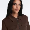 Jacke im Neopren-Look mit Schößchen und Rippbündchen