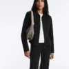 Jacke im Neopren-Look mit Schößchen und Rippbündchen Jacke im Neopren-Look mit Schößchen und Rippbündchen