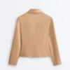 Jacke im Neopren-Look mit Schößchen und Rippbündchen Jacke im Neopren-Look mit Schößchen und Rippbündchen