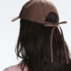 Kappe im Washed-Look aus 100 % Baumwolle mit Bindeband Kappe im Washed-Look aus 100 % Baumwolle mit Bindeband