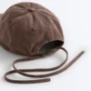 Kappe im Washed-Look aus 100 % Baumwolle mit Bindeband Kappe im Washed-Look aus 100 % Baumwolle mit Bindeband