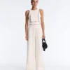 Langer Piqué-Jumpsuit mit Paspelierung aus Baumwolle Langer Piqué-Jumpsuit mit Paspelierung aus Baumwolle