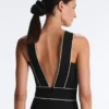 Langer Piqué-Jumpsuit mit Paspelierung aus Baumwolle Langer Piqué-Jumpsuit mit Paspelierung aus Baumwolle