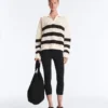 Langärmliges Polohemd aus 100 % Baumwolle mit gestreiftem, offenem Strickmuster Langärmliges Polohemd aus 100 % Baumwolle mit gestreiftem, offenem Strickmuster