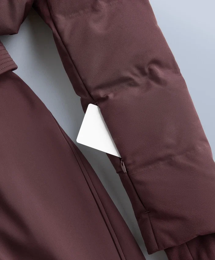 Minardi Piume Ski – wasserabweisender, gefütterter Jumpsuit mit 80 % Daunen- und 20 % Federfüllung Minardi Piume Ski – wasserabweisender, gefütterter Jumpsuit mit 80 % Daunen- und 20 % Federfüllung