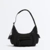 Mini-Tasche mit Maxi-Taschen Mini-Tasche mit Maxi-Taschen