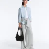 Mini-Tasche mit Maxi-Taschen Mini-Tasche mit Maxi-Taschen
