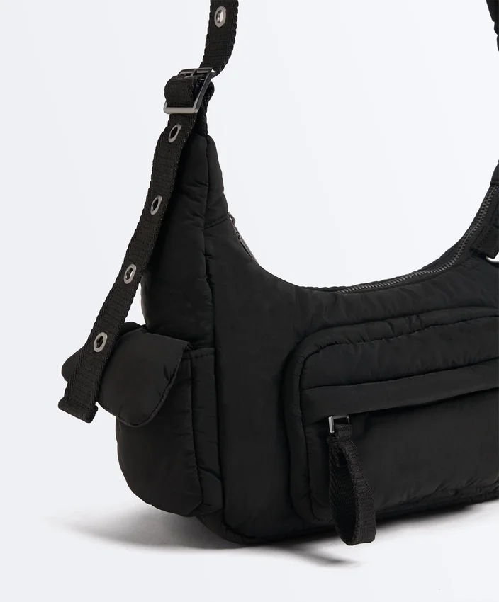 Mini-Tasche mit Maxi-Taschen Mini-Tasche mit Maxi-Taschen
