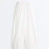 Plissierte, konisch zulaufende Hose aus 100 % Baumwolle Plissierte, konisch zulaufende Hose aus 100 % Baumwolle