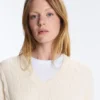 Pullover aus 100 % Baumwolle mit Zopfmuster und V-Ausschnitt Pullover aus 100 % Baumwolle mit Zopfmuster und V-Ausschnitt