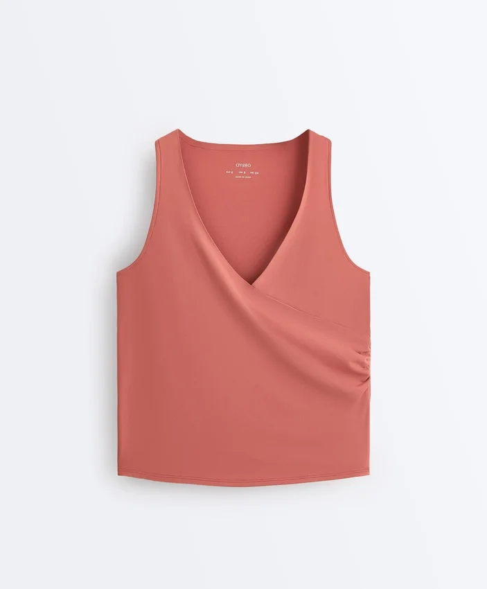 Ärmelloses Comfortlux-T-Shirt mit Überkreuz-Ausschnitt Ärmelloses Comfortlux-T-Shirt mit Überkreuz-Ausschnitt