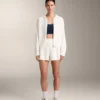 Gewaschene Strickjacke mit Kapuze Gewaschene Strickjacke mit Kapuze