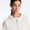 Strukturierte Strickjacke mit Kapuze Strukturierte Strickjacke mit Kapuze